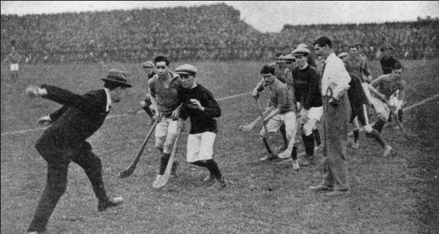 Michael Collins in Croke Park throwing a sliotar at a hurling match in 1921